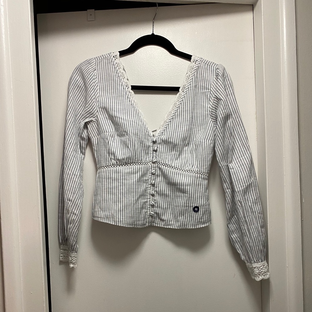 Blue and white striped fitted blouse